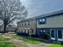 Townhome with brick and siding, showing well-maintained landscaping and inviting front entrances at 4520 Central Ave # C, Charlotte, NC 28205