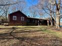 Charming single-story home boasting a long porch and inviting curb appeal set on spacious lot at 4926 Stack Rd, Monroe, NC 28112