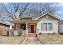 Inviting home with a red front door, covered porch, and attractive landscaping at 524 W Horah St, Salisbury, NC 28144