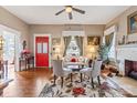 Bright living room with hardwood floors, fireplace, and a charming red door at 524 W Horah St, Salisbury, NC 28144