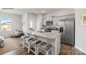 A bright kitchen with granite countertops, stainless steel appliances and island seating at 529 Trading Post Ln, York, SC 29745