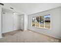 Inviting living room with large window providing ample natural light at 5600 Burleson Dr, Charlotte, NC 28215