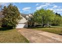 Lovely two-story home featuring a spacious driveway, attached garage and a covered porch at 6720 Neuhoff Ln, Charlotte, NC 28269