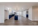 Kitchen pantry with a sliding barn door and many shelves for storage at 1114 University Dr, Lancaster, SC 29720