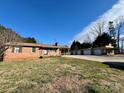 A cozy single-story brick home with an expansive yard and detached garage at 1168 Mcclain Rd, Hiddenite, NC 28636