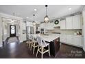 Bright kitchen featuring a large center island, pendant lighting, and stainless steel appliances at 124 Helton Ln, Fort Mill, SC 29708