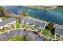 Overhead shot showcasing the complex's layout near the lake, parking area, and manicured lawns at 130 Water Oak Dr, Pineville, NC 28134