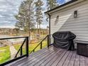 Outdoor deck area overlooking the lake, complete with a grill for outdoor cooking at 144 Morgan Bluff Rd, Mooresville, NC 28117