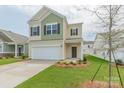 Charming two-story home featuring a two-car garage and manicured front lawn at 1620 Troon Dr, Salisbury, NC 28144