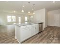 Open kitchen with granite countertops, an island, and stainless steel appliances at 1620 Troon Dr, Salisbury, NC 28144