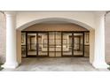 Condo entrance with glass doors and visible mailboxes, under an archway with brick accents at 211 Heritage Blvd # 612, Fort Mill, SC 29715