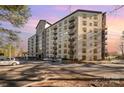 A modern condominium with large windows and small balconies on a sunny day with ample parking at 211 Heritage Blvd # 612, Fort Mill, SC 29715