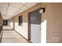 Hallway leading to unit 612, featuring neutral decor and a small window at 211 Heritage Blvd # 612, Fort Mill, SC 29715