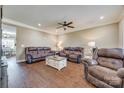 Spacious living room featuring dark wood floors, recessed lighting and comfortable leather furniture at 2375 Ellison Cir, Lancaster, SC 29720