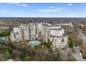 A high angle view of the luxury apartments featuring a swimming pool and lush greenery, offering an upscale lifestyle at 2823 Providence Rd # 156, Charlotte, NC 28211