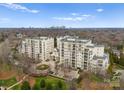 Scenic aerial shot of upscale apartment buildings, showcasing the beautiful architecture and lush surroundings at 2823 Providence Rd # 156, Charlotte, NC 28211