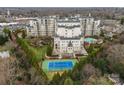 Overhead view showcasing the apartment complex with a tennis court and manicured landscaping, perfect for an active lifestyle at 2823 Providence Rd # 156, Charlotte, NC 28211