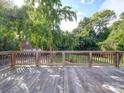 Spacious wooden deck overlooking a private, tree-lined backyard at 303 Wade St, Wadesboro, NC 28170