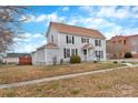 Quaint home featuring light gray siding, manicured lawn, a deck, and inviting curb appeal at 315 E Washington Ave, Bessemer City, NC 28016