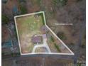 Aerial view showcasing approximate lot lines of a home with a large yard and mature trees and a private, fenced backyard at 3155 Ramseur St, Lincolnton, NC 28092