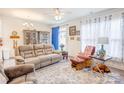 Inviting living room featuring a comfortable sofa, stylish accents, and a bright window creating a warm and welcoming atmosphere at 3941 Rothwood Ln, Harrisburg, NC 28075