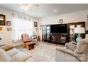 Cozy living room with a large window, plush seating, and elegant decor, perfect for relaxation and entertaining at 3941 Rothwood Ln, Harrisburg, NC 28075