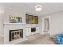 Inviting living room with a brick fireplace, built-in shelving, and a neutral color palette at 424 Virginia Ave, Statesville, NC 28677