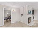 Inviting living room with a fireplace, leading to the dining area with a table and chairs at 424 Virginia Ave, Statesville, NC 28677