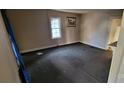 Empty bedroom space with a window for natural light at 525 S Trenton St, Gastonia, NC 28052