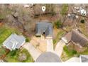 Overhead view of a house in a quiet neighborhood showing its roof, driveway, and proximity to neighboring homes at 6311 Gold Dust Ct, Charlotte, NC 28269