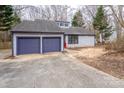 Charming single-story home featuring a two-car garage, blue trim, and well-maintained landscaping at 6415 Santa Cruz Trl # 11, Charlotte, NC 28227