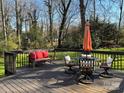 Spacious back deck featuring outdoor seating, ideal for relaxing and enjoying the beautiful backyard view at 7305 Park Vista Cir, Charlotte, NC 28226