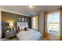 A serene bedroom with a large window and warm, inviting decor at 7669 Bainbridge Rd, Sherrills Ford, NC 28673