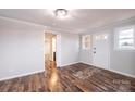 Welcoming entryway boasts wood-look floors, neutral paint, and transitions into adjoining rooms at 9026 Nc 10 Hwy, Vale, NC 28168