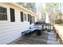 Spacious deck area featuring outdoor seating, a grill, and an umbrella for shade at 1020 Saint Paul Church Rd, Clover, SC 29710