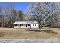 View of the house behind a large blossoming tree at 1020 Saint Paul Church Rd, Clover, SC 29710