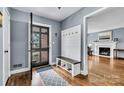 Inviting foyer with stylish decor, featuring a coat rack bench and a view into the living room at 1101 Roundknob Ave, Salisbury, NC 28144