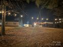 Backyard with string lights on a cold night, creating a cozy and inviting atmosphere at 1165 Golden Maple Ln, Chester, SC 29706