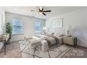 Serene bedroom showcasing neutral tones, soft textures, and ample natural light at 117 Mountain View St, Gastonia, NC 28052