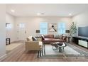 Bright living room with modern furniture, natural light, and stylish decor at 117 Mountain View St, Gastonia, NC 28052