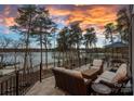 Backyard patio featuring a lakeside view with comfortable outdoor seating arrangements and scenic vistas at 130 Brick Kiln Way, Mooresville, NC 28117