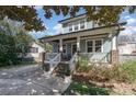 Beautiful two-story house featuring a spacious front porch and well-maintained landscaping at 130 N Smallwood Pl, Charlotte, NC 28216