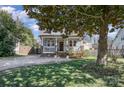 Inviting two-story home with a covered front porch and lush green lawn at 130 N Smallwood Pl, Charlotte, NC 28216