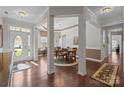 The grand foyer flows to the dining room, with beautiful hardwood floors and natural light at 1668 Onyx Rdg # 116, Fort Mill, SC 29708