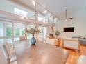Bright dining area featuring stylish lighting fixtures, hardwood floors, and access to the outdoors at 18 Pickett Ave, Spencer, NC 28159