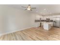 Bright living space with hardwood floors, ceiling fan, and modern kitchen at 2829 New Pineola Rd # 7B, Charlotte, NC 28208
