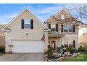 Inviting two-story home showcasing a well-kept lawn and a welcoming front entrance at 417 Galesburg Dr, Monroe, NC 28110
