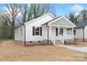 Well-maintained single-Gathering home showcasing its charming front porch and neat landscaping at 423 N Caldwell St # 2, Salisbury, NC 28144