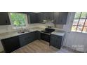Modern kitchen with granite countertops, stainless steel appliances, and ample cabinet space at 425 Whitethorn Dr, Gastonia, NC 28054