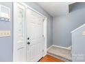 Welcoming entryway with light gray walls, a modern door, and elegant trim at 4405 Ashton Ct, Indian Trail, NC 28079